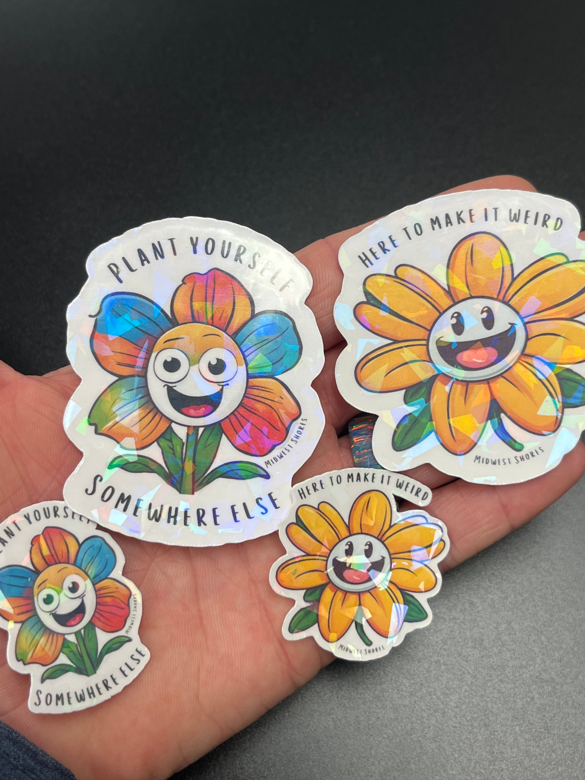 “Plant yourself somewhere else” Daisy sticker and “here to make it weird” daisy sticker 