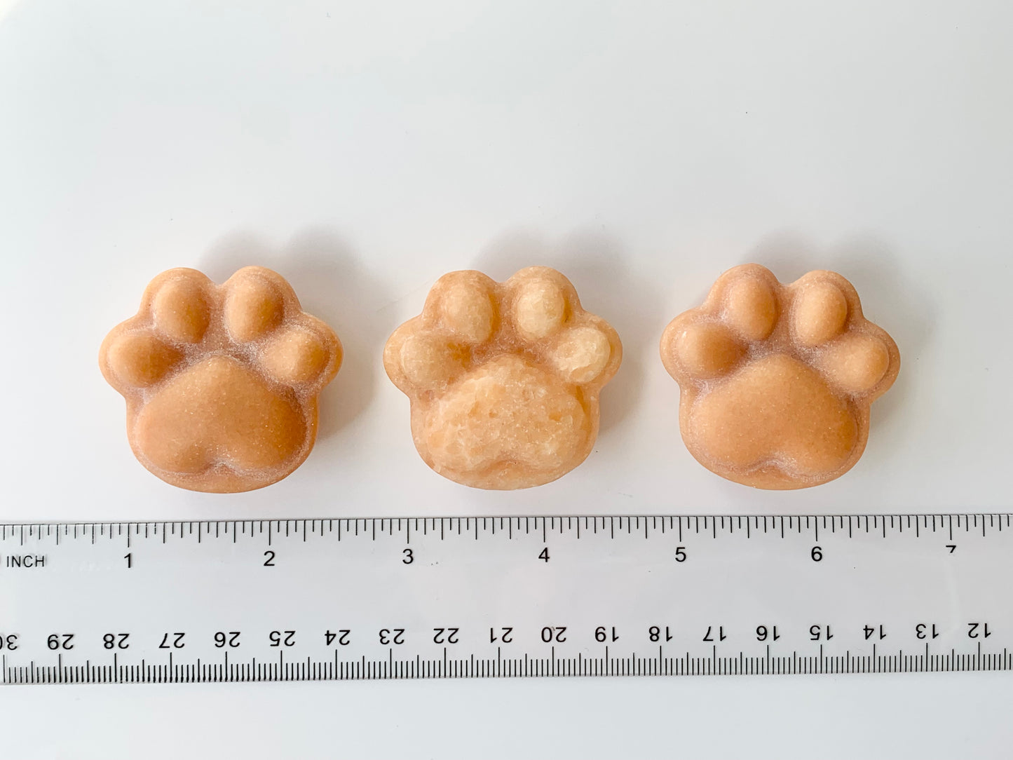 Small Paw Print Carving, Orange Calcite ~1.5"