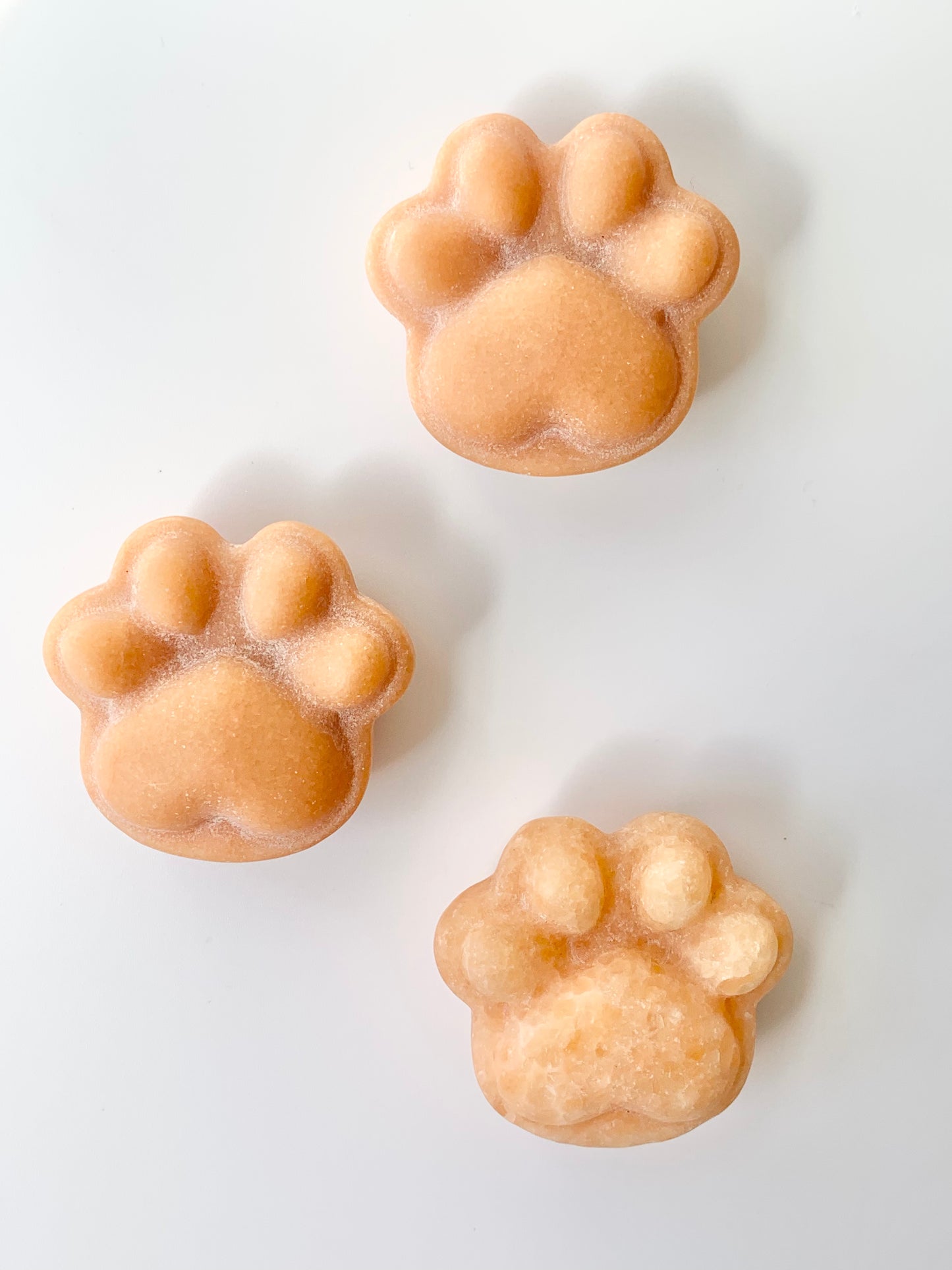 Small Paw Print Carving, Orange Calcite ~1.5"